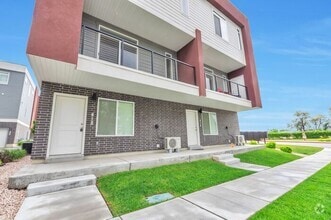 Building Photo - Modern End Unit townhouse w attached 2 car...