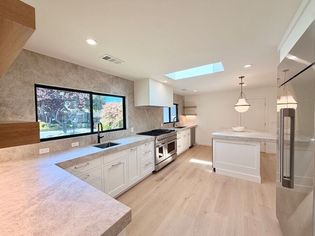Building Photo - This premier 4-bed, 3-bath estate spans 2,565 sq. ft. on a 10,253 sq. ft. lot in North Los Altos.