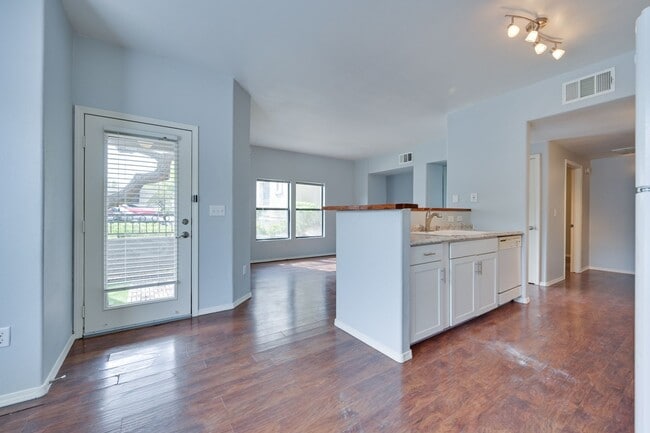 Building Photo - NW!! Gated!!! Clubhouse!!!Community Pool!!! 1st Floor Condo!!! Wood like floors!! No Carpet!!