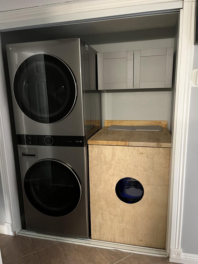 Stainless steel washer and dryer with cat box enclosure - 9440 N 52nd Ln