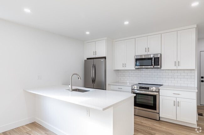 1BR, 1BA - 675SF - Kitchen with Quartz Island and new appliances. - 365 Broad St