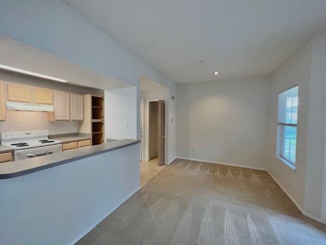 Building Photo - Move in NOW- Spacious 2 bedroom 1 bath condo on 3rd floor in gated community! Water included with...