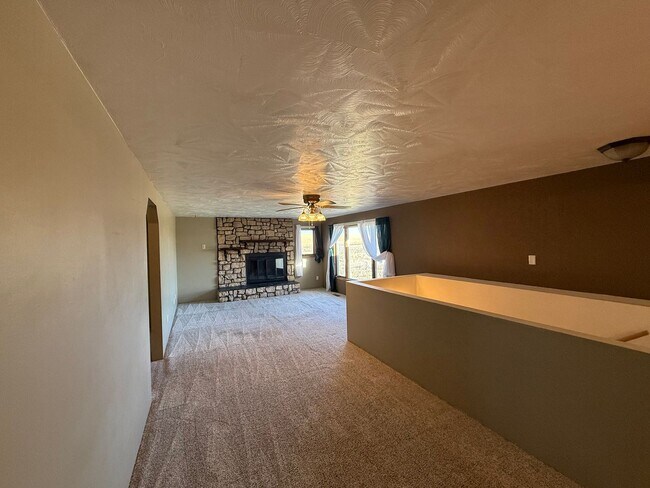 Building Photo - Spacious, four-bedroom, two-bathroom, coun...