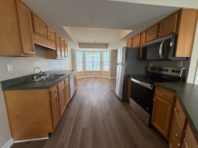 Building Photo - MOVE IN SPECIAL!! LARGE BEAUTIFUL 3 Bedroom 2.5 Bath Townhouse w/Finished Basement, Fenced in Yar...