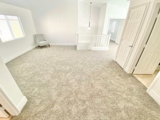 Building Photo - STUNNING 2 STORY HOME IN A GUARD GATED COM...