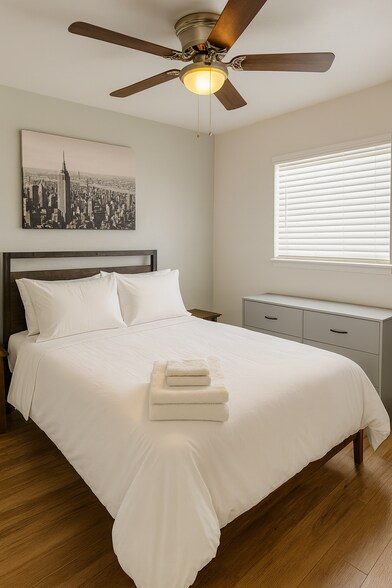 Guest bedroom with 1 full-size bed and plenty of space to unwind. - 10116 Mercedes St