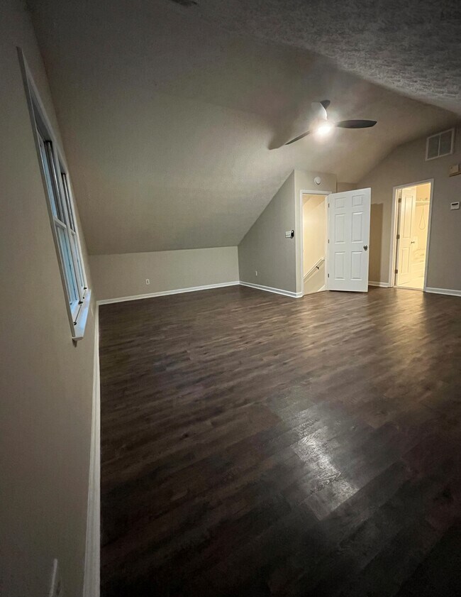 Upstairs HUGE bedroom - view of entrance and doors to closets and bathroom - 440 Williamsburg Way