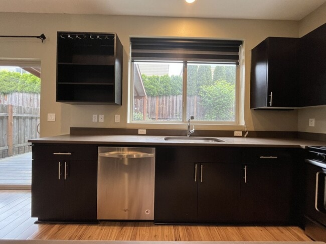 Building Photo - Charming 3 Bedroom, 2.5 Bathroom Home with Large Living Room, Tall Windows, Island Kitchen, and A...