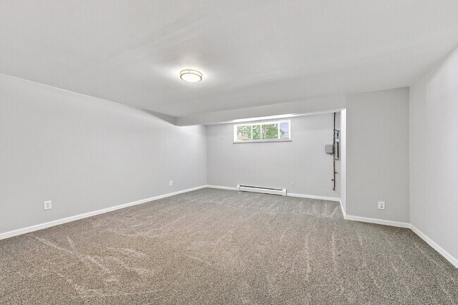Building Photo - AVAILABLE NOW  Spacious 4-Bedroom Wheat Ridge Home with Finished Garden Level, Two-Car Garage & B...