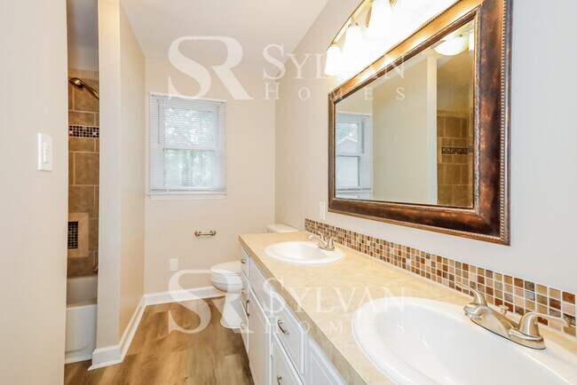 Building Photo - The living is easy in this 4 bedroom, 2 bathroom home