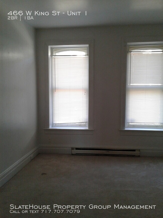 Building Photo - First floor two bedroom with yard!