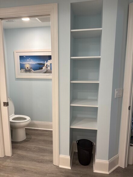 Newly remodeled master bath along with built in shelving - 1031 1st St S