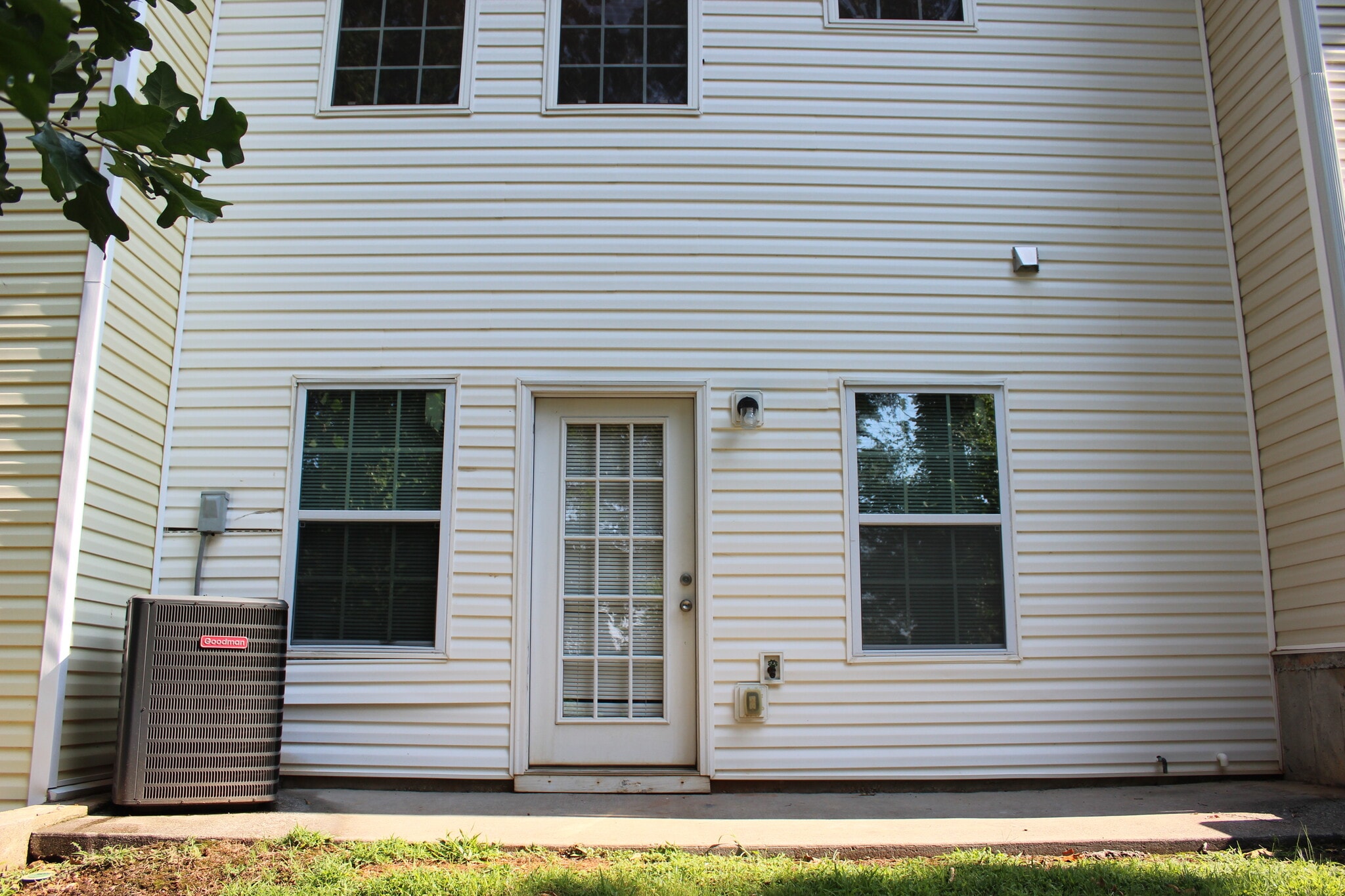 Rear patio with walkout access from unfinished basement. - 48 Timber Ridge Dr