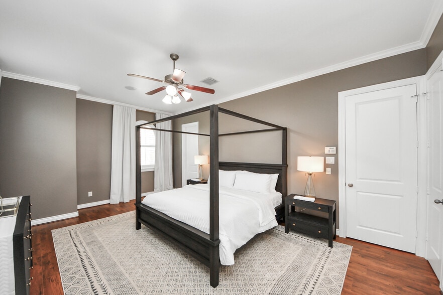 Soft gray walls and crisp white drapery create a timeless, restful retreat. - 620 Rutland St