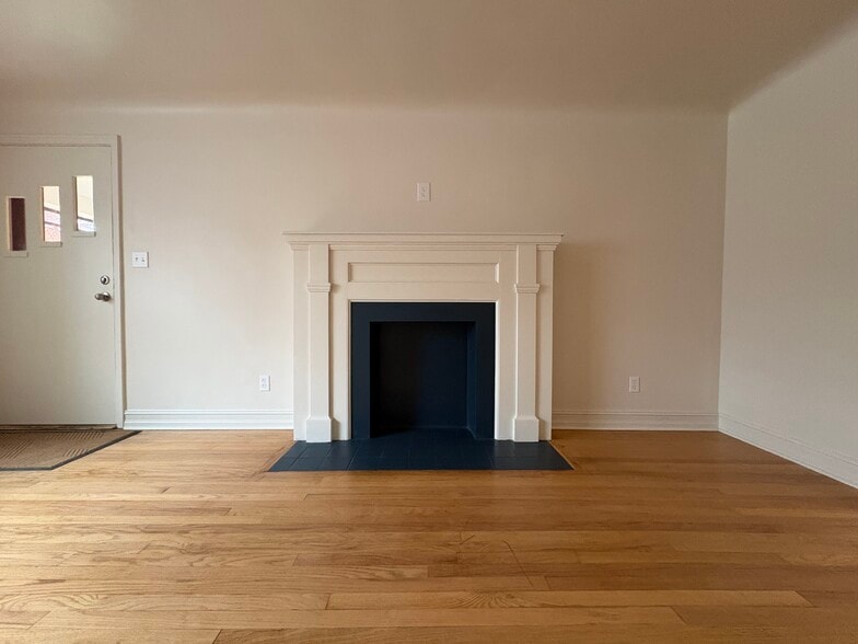 Decorative fireplace and refinished hardwood floors - 6035 Oakwood Ave