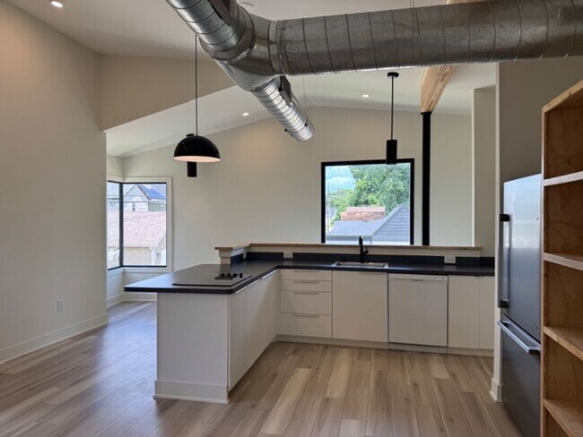 Building Photo - Vaulted Ceilings & Hardwood Floors in This Charming Indianapolis L