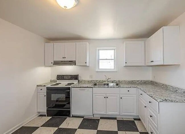 Building Photo - Newly Renovated 4BR/1BA Single-Family Home with Garage – Cleveland