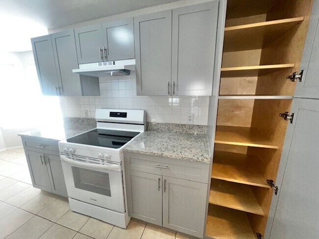 Building Photo - NEW-Remodeled bathroom & kitchen! NEW VINYL PLANK flooring & fresh paint! 2 bedroom 1 bath condo ...