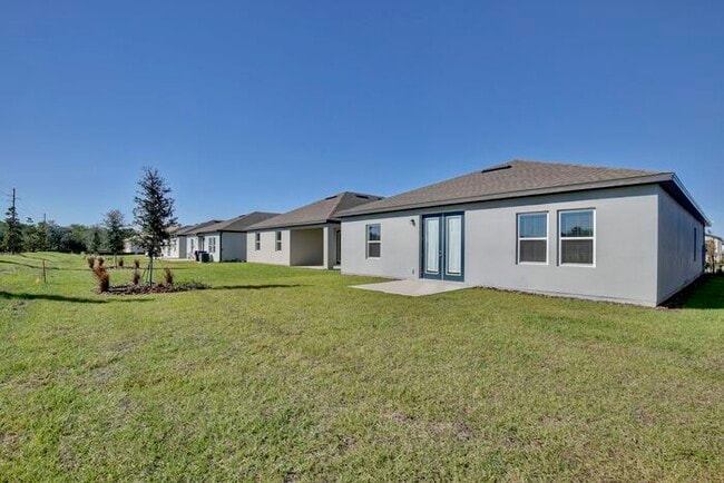 Building Photo - Stylish Sunbrooke Sanctuary! Modern 4/2 Home with High Ceilings, Designer Kitchen & Resort Amenities