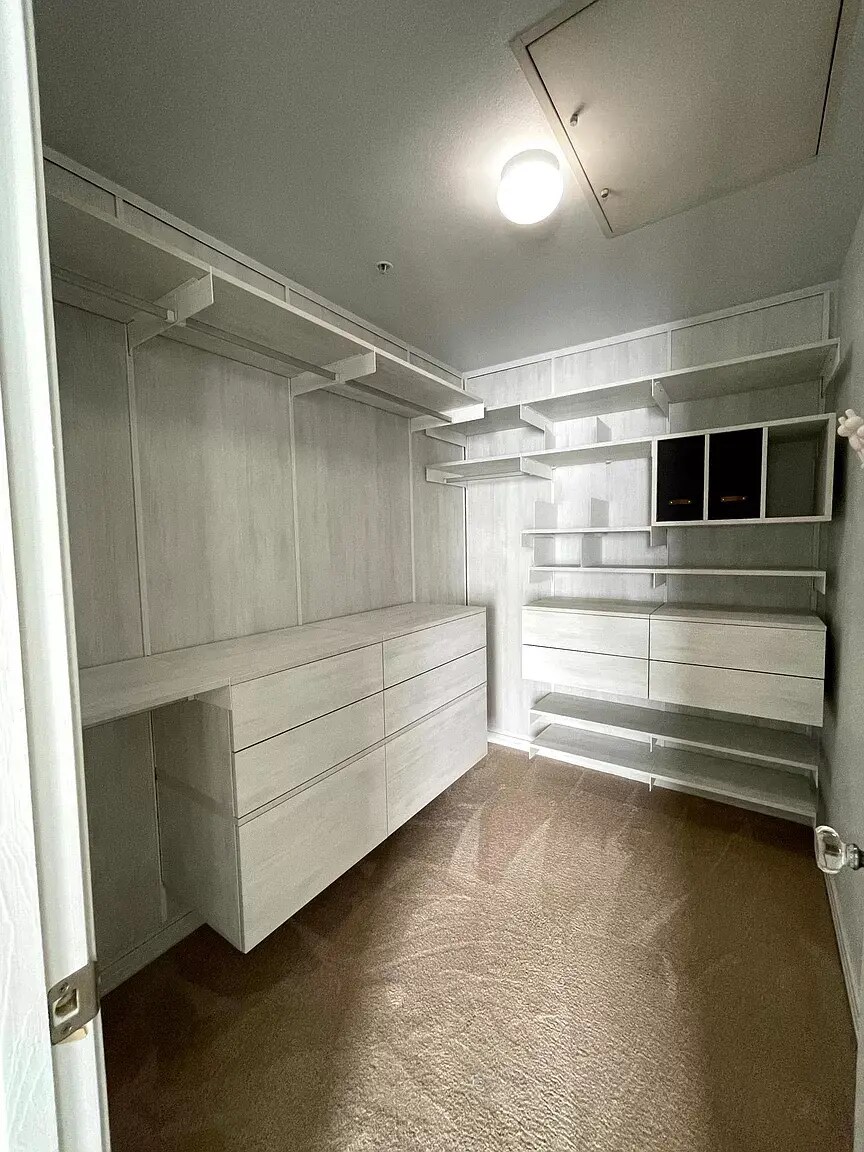 Custom walk-in closet with soft-close drawers and plenty of room for shoes. - 1641 N Washington St