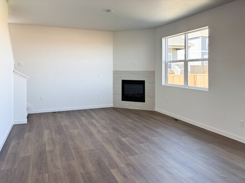 Living Room w/ Fireplace - 14611 Beebalm Ave