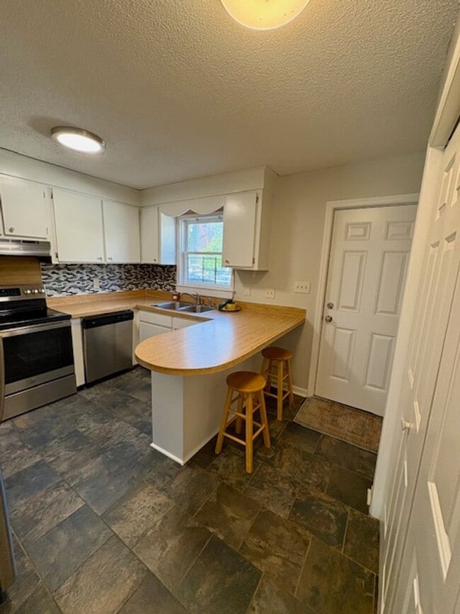 Building Photo - Charming End Unit Two Bedroom Townhome on ...