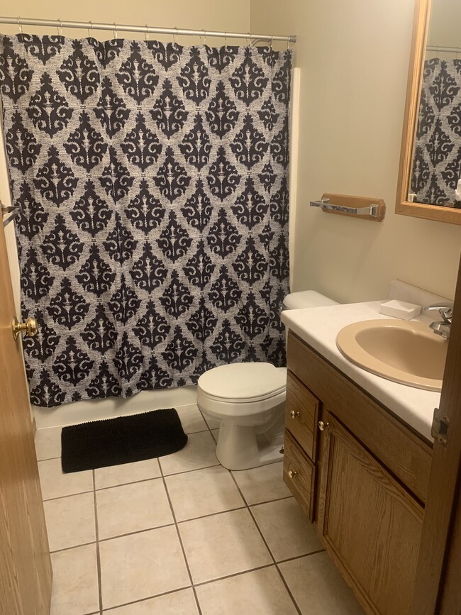 2 full baths - one up and one down. Bath feature tile flooring, new paint - very clean! - 1716 5th St E