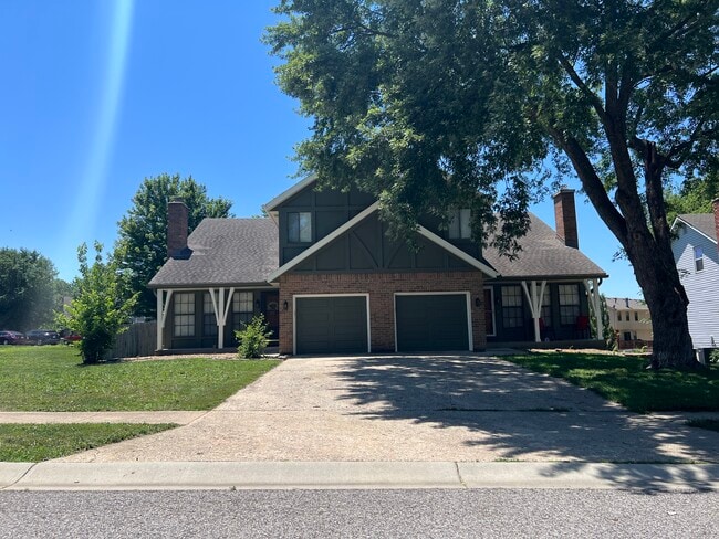 Front of duplex (unit is on the right, large tree has been removed) - 14103 W 88th Terrace