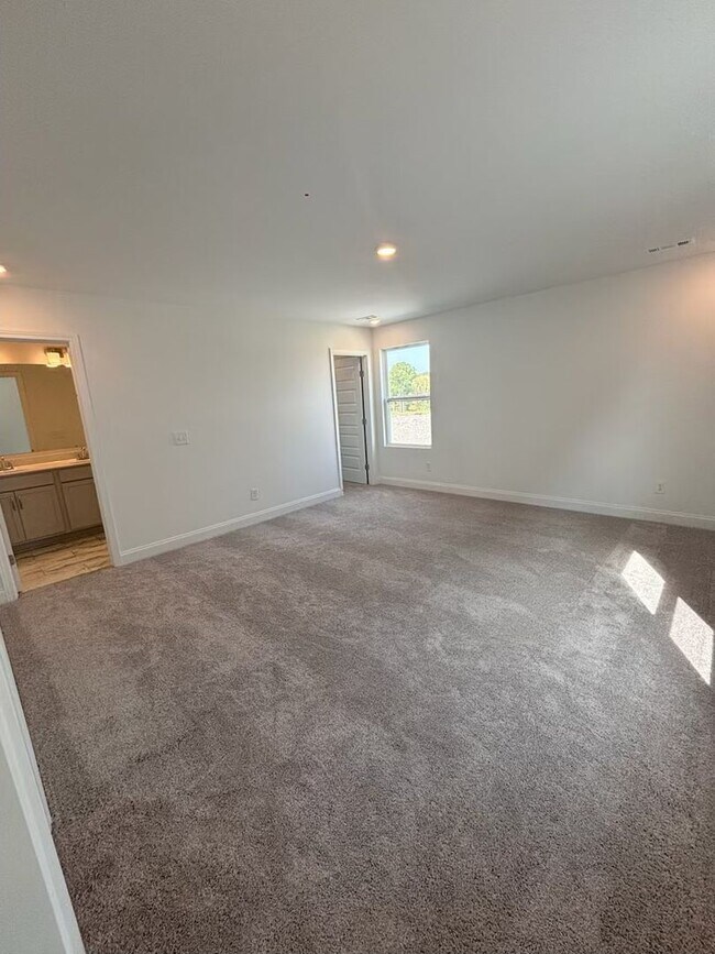Building Photo - **BE THE LUCKY ONE TO LIVE IN THIS 2024-BUILT END-UNIT TOWNHOME IN A RESORT-STYLE COMMUNITY**