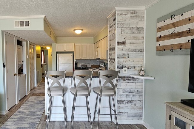 Building Photo - Dreamy Little River Condo — Furnished, Elevator Access, Pool & Marina Nearby!