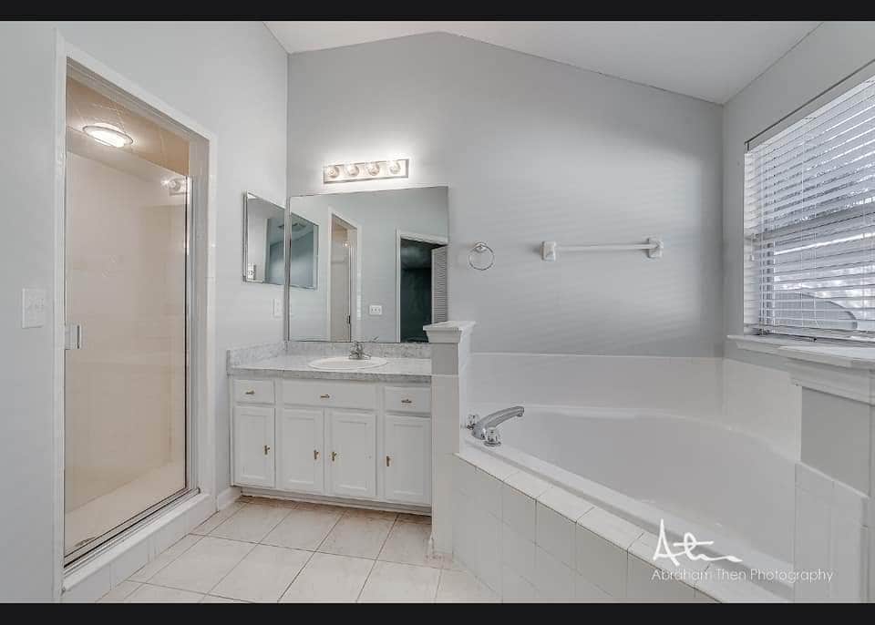Master bathroom with shower and bathtub - 11160 Apple Blossom Trl W