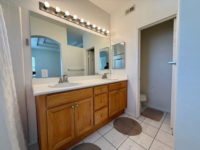 Building Photo - Spacious 3 Bedroom 2.5 Bath Townhouse with Private Garden Patio & a Community Pool/Spa! Attached ...