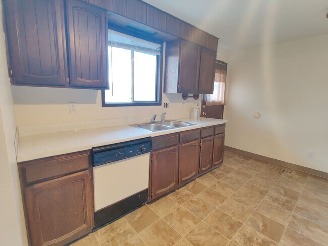 Building Photo - Duplex with garage and fenced yard and upd...