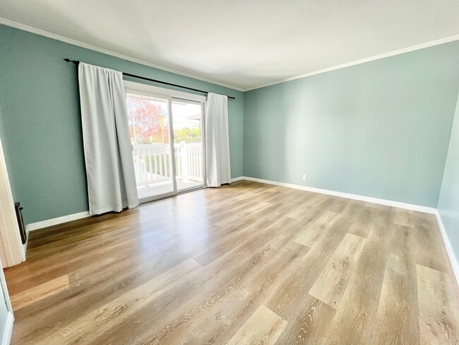 Building Photo - Contemporary 2 Bed Condo with 2 Garage Parking Spaces, Community Pool, and 3 Private Balconies