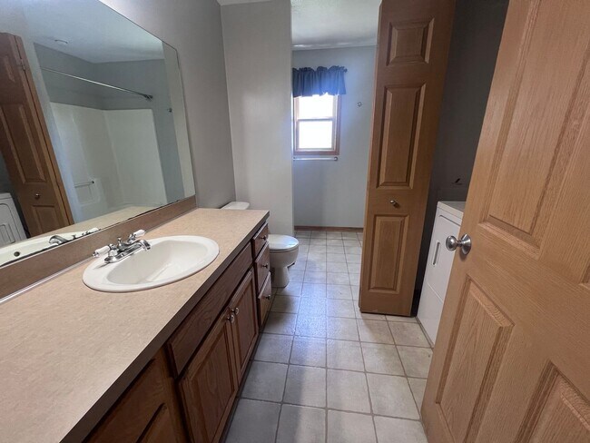 Building Photo - Spacious Duplex in Walker! Two Stall Garage!