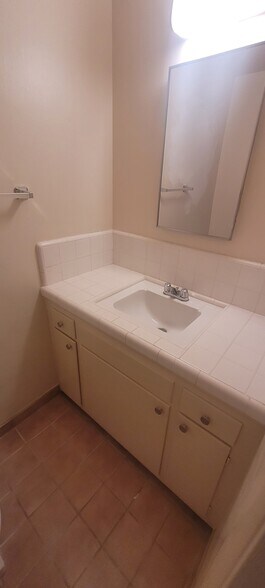 1/2 bath with toilet not shown located off living room hallway - 8934 Wonderland Ave