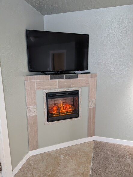 TV & electric fireplace - 8211 Florida Dr