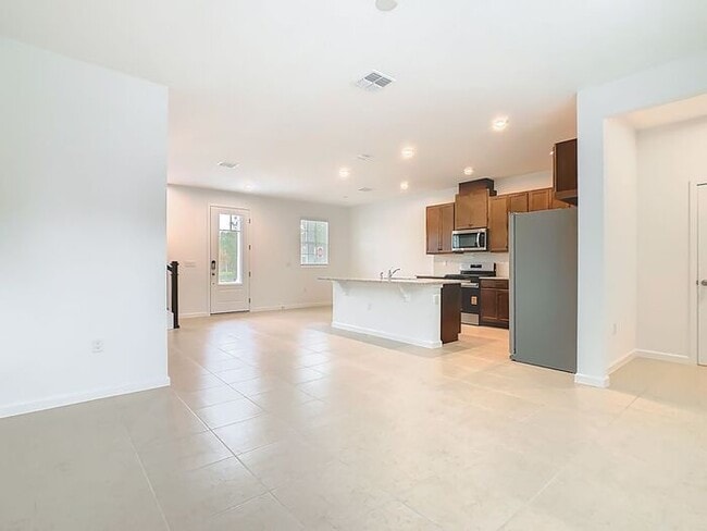 Building Photo - New Luxury Townhome in Celebration, FL Corner unit. All porcelain tiled floors. Aleutian model by...