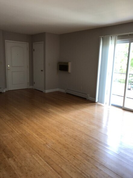 Living Room with Balcony - 7076 New Yorker Ave