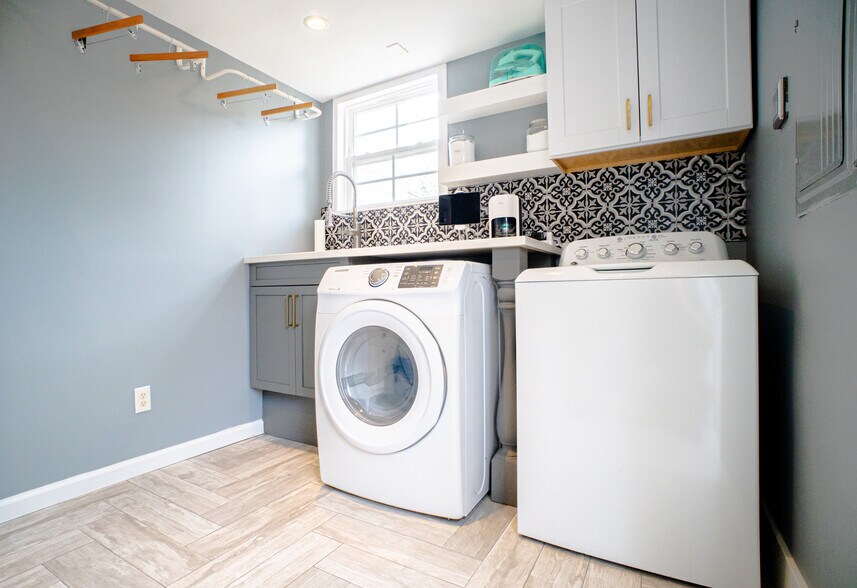 Spacious laundry room with sink and cabinets - 1215 Landon Ave