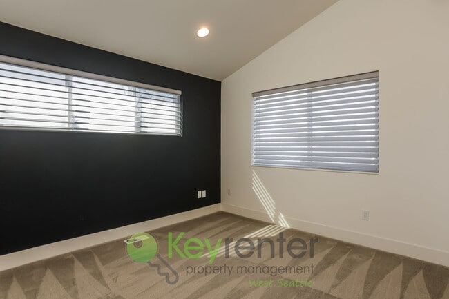 Building Photo - Spacious Living with Balconies, Deck, and Private Yard