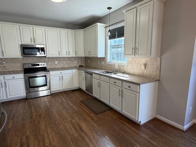 The kitchen includes generous amount of cabinet and counter top space - 6419 Woodmont Rd