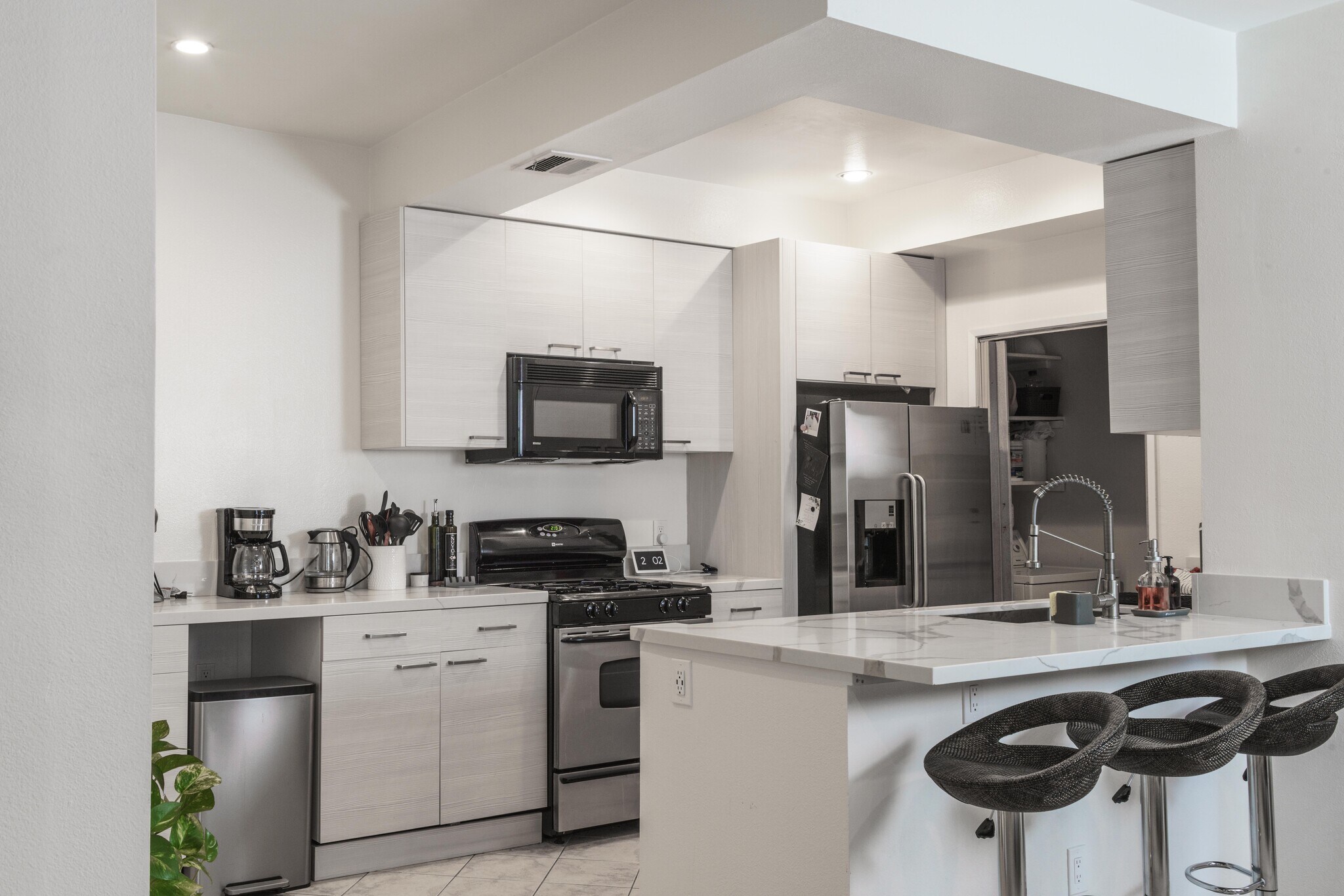 Kitchen, stainless appliances and washer/dryer pantry - 10021 Tabor Street