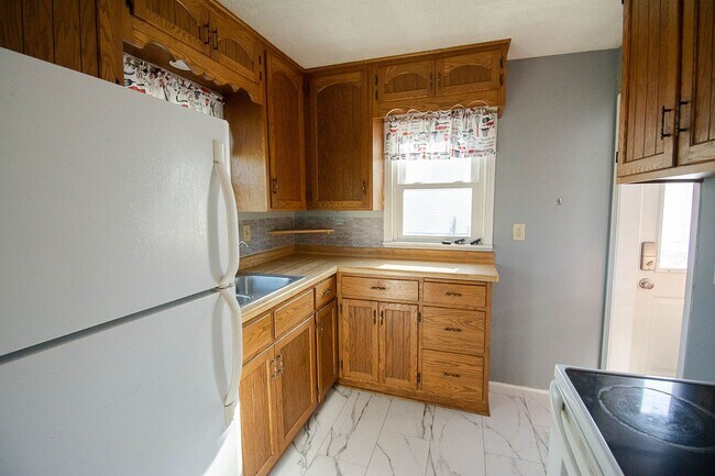 Building Photo - Fenced Yard, 2-Car Garage + Internet Included