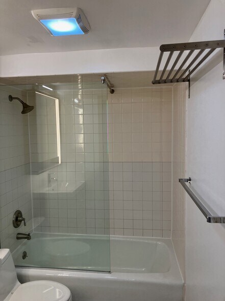 bathroom step in shower with glasss shower wall& racks for towels - 143 Sussex St