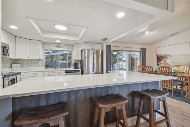 Building Photo - ***PRIVATE HEATED POOL*** Beautiful, Fully-Furnished 3-Bedroom Home Available April 1, 2026!   **...