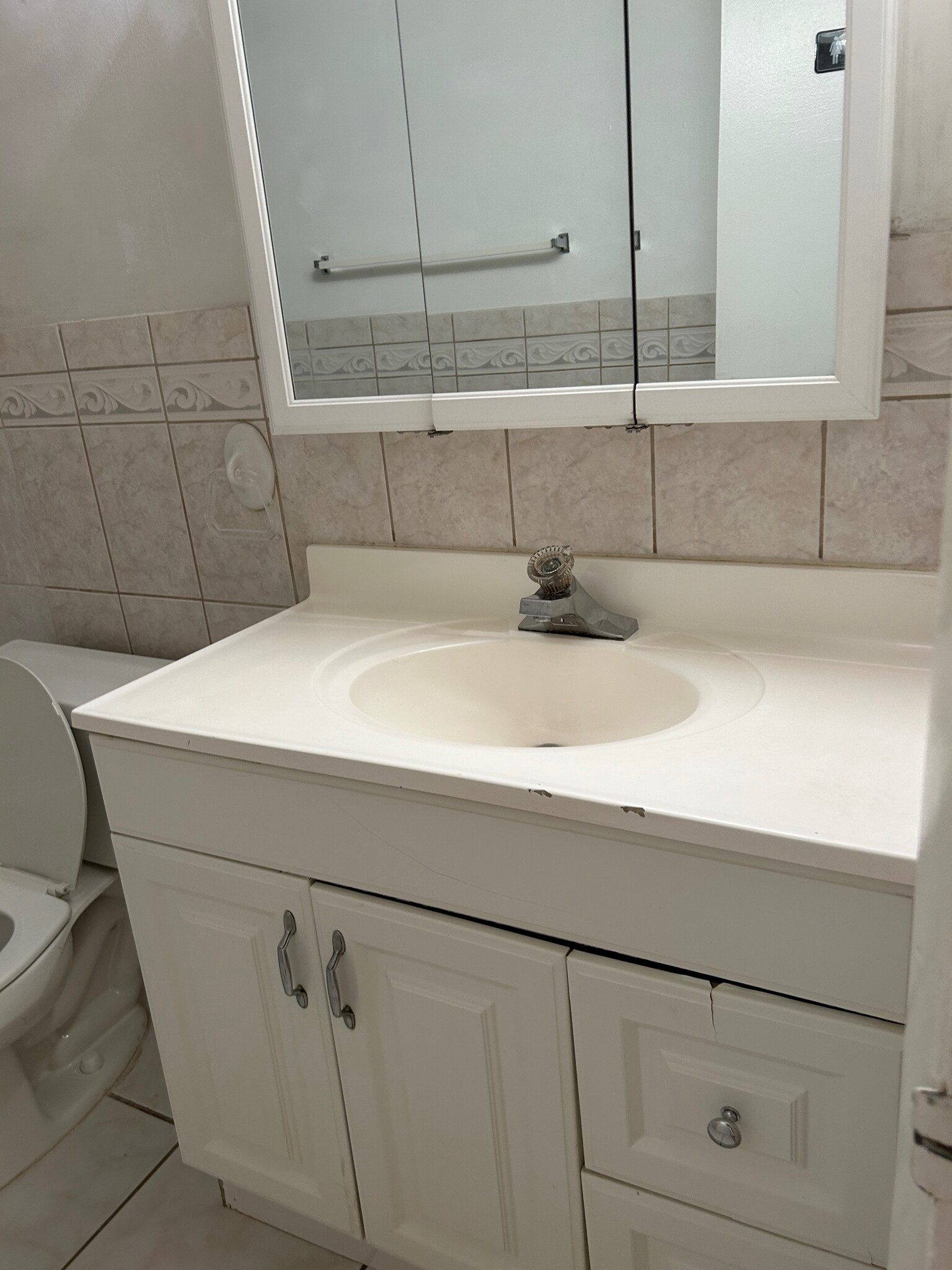 2nd bathroom with medicine and vanity cabinets with storage - 265 SW 7th St