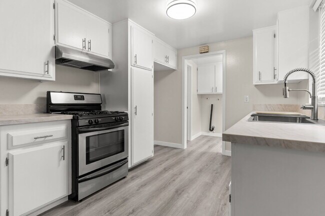 Building Photo - Charming Updated Home With Drive-Through Garage Access