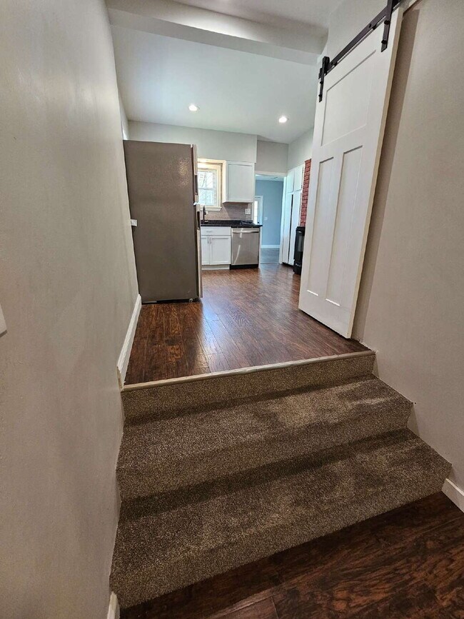 Building Photo - Duplex - 2 Bedroom, 2 Full Bathrooms and a 2 Car Garage. Updated Living Space with Hardwood Floor...