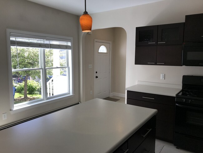 Kitchen looking out to the private yard and front door - 28 Munjoy St